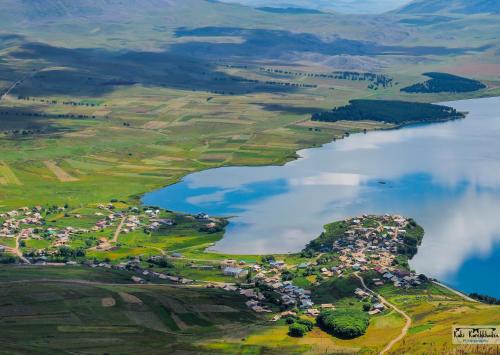 an aerial view of a town next to a body of water at Guest House BALU in Kutaisi