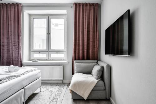 Μια τηλεόραση ή/και κέντρο ψυχαγωγίας στο Stylish downtown studio apartment