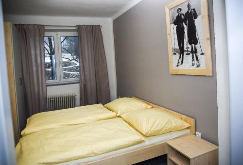 Postel nebo postele na pokoji v ubytování Penzion Kouty