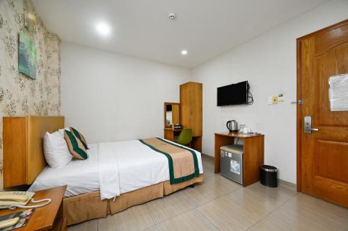 Camila Airport Hotelにあるベッド