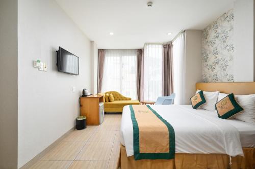 Camila Airport Hotelにあるベッド
