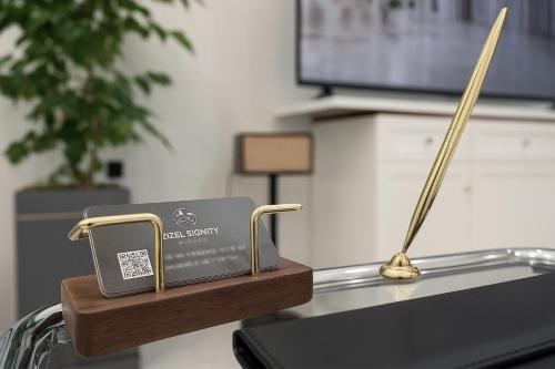 a charger and a cell phone sitting on top of a table at Zizel Suite Room Seocho in Seoul