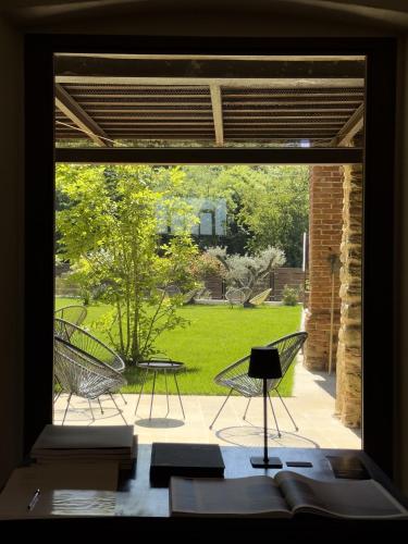 a view from a window of a patio with chairs at Santo Stefano Rondini in Vicoforte