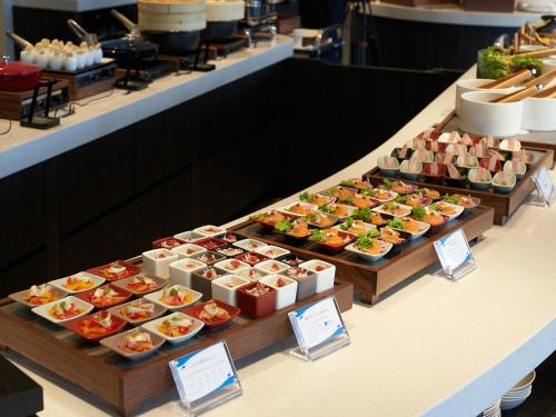 a buffet line with many different types of food at Kobe Suma Seaworld Hotel in Kobe