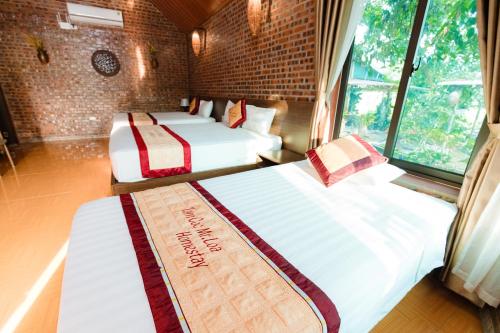 Кровать или кровати в номере Tam Coc Mr Loa Bungalow & Resort