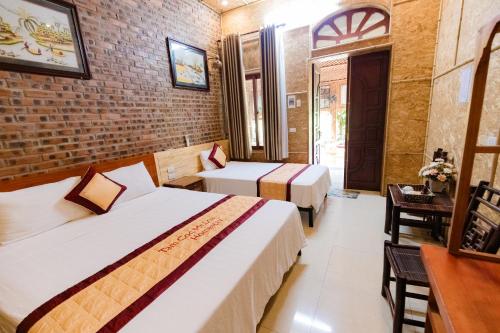 Кровать или кровати в номере Tam Coc Mr Loa Bungalow & Resort