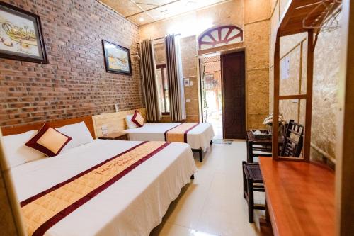 Кровать или кровати в номере Tam Coc Mr Loa Bungalow & Resort