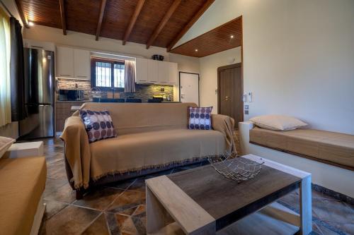 a living room with a couch and a table at Seaside Serenity Retreat - Nea Makri by ΜΡS in Nea Makri