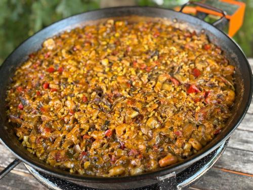 a pan filled with food on top of a table at Casa Rural con encanto Señorio Manchego ALBACETE in Yeste
