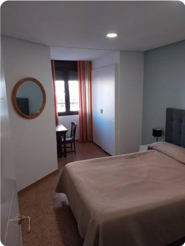 Кровать или кровати в номере Bonito Apartamento en la Nogalera