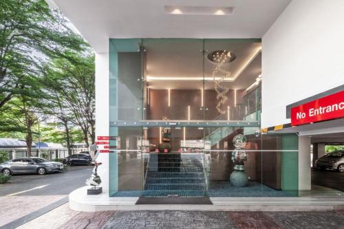 a building with a no entry sign in front of it at Hi Hotel in Makkasan