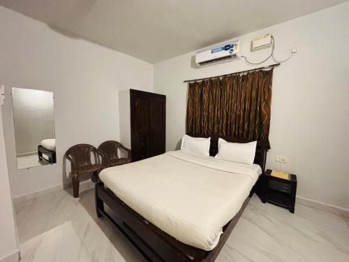 Postel nebo postele na pokoji v ubytování Mehar Rooms
