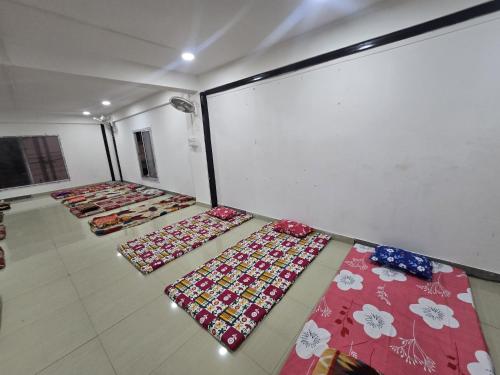 a room filled with lots of ties on the floor at Hotel Pohor Regency Near Kamakhya Gate Foot Bridge in Guwahati