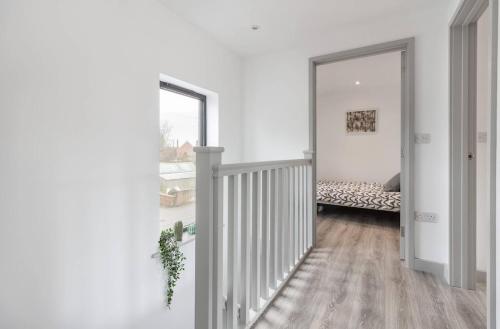 a hallway with a stairway leading to a bedroom at Zest Homes 87b Bridge Street in Leominster