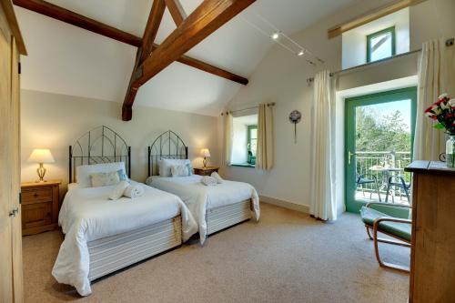 Ένα ή περισσότερα κρεβάτια σε δωμάτιο στο The Loft at Spindlestone