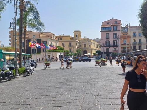 a group of people walking down a city street at A casa di Erica in Sorrento