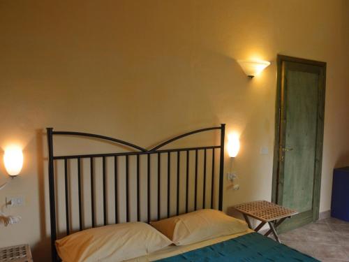 Кровать или кровати в номере Agriturismo La Palazzina