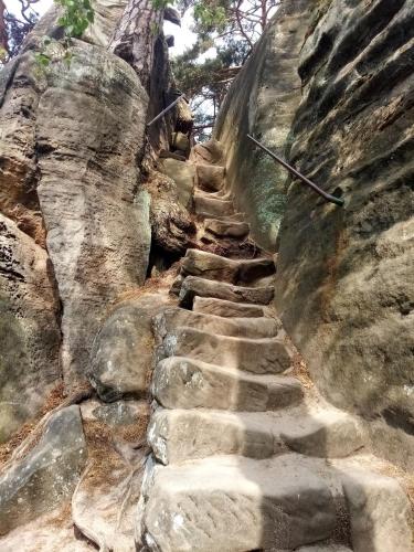 a stone stairway leading up a rock wall at Vila Hamrska in Velké Hamry