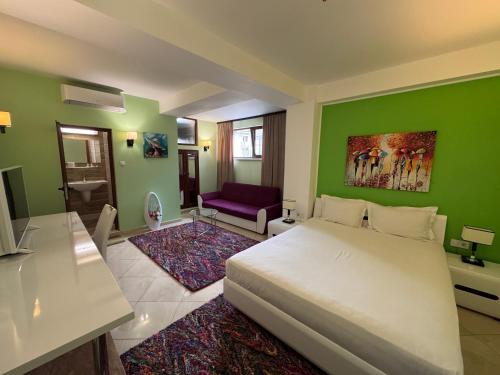 Postel nebo postele na pokoji v ubytování Hotel Dafi