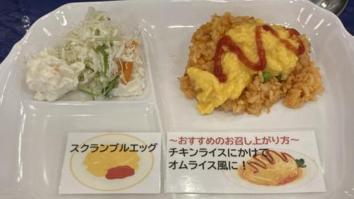 a plastic container of food with rice and vegetables at Toyoko Inn Hokkaido Tomakomai Ekimae in Tomakomai