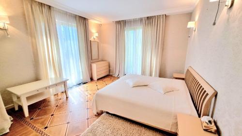 Postel nebo postele na pokoji v ubytování Aristo apartment