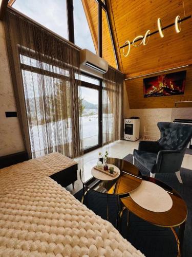 a room with a bed and a table and chairs at Weekend house - Vlašić in Vlasic