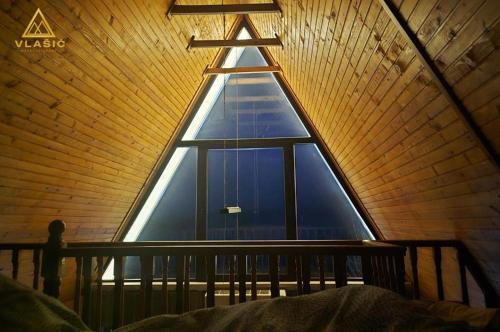 a large window in a room with a roof at Weekend house - Vlašić in Vlasic