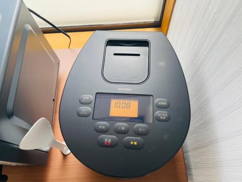 an electronic device sitting on top of a desk at Nagomi Hanare in Matsumoto