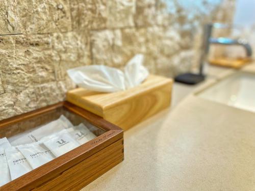 a wooden box sitting on top of a counter at Anzhu Seamate Villa Samui in Amphoe Koh Samui