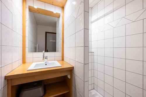 a bathroom with a sink and a mirror at Studio 9 - La Palettaz in Crest-Voland