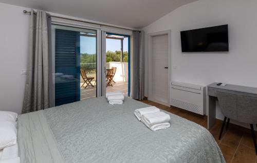 Ένα ή περισσότερα κρεβάτια σε δωμάτιο στο Villa Olea by Villas Guide