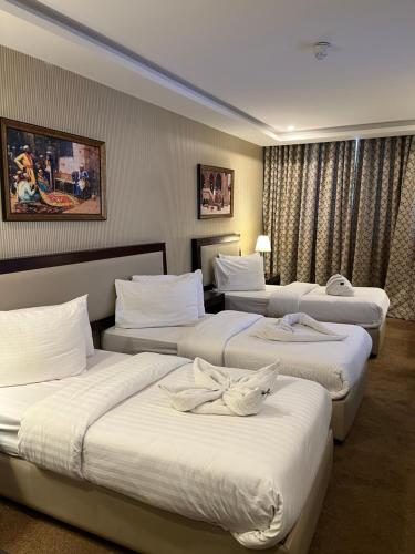 Postel nebo postele na pokoji v ubytování Strand Hotel Jordan