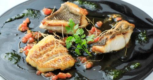 a plate of food with fish and vegetables on it at Villa The Club 御殿場ウエスト in Gotemba