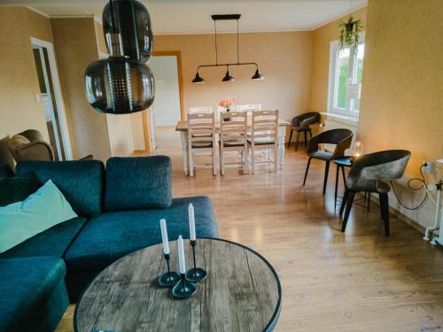a living room with a couch and a table at Lakefront house on Skåne's largest island in Ivö