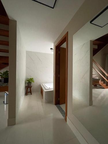 a bathroom with a sink and a toilet at Estância Shangri-La in Santa Teresa