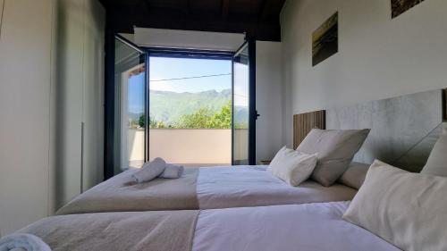 En eller flere senge i et værelse på Casa vacacional Mar y Cuera