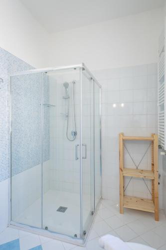 a shower with a glass door in a bathroom at The Garden in Maiori