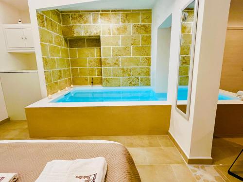 a bathroom with a tub in a room at Corte Gabellone - dimora storica in Nardò