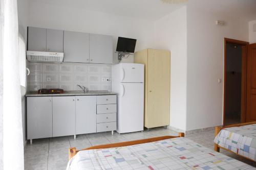 Kuchyň nebo kuchyňský kout v ubytování Flora Rooms