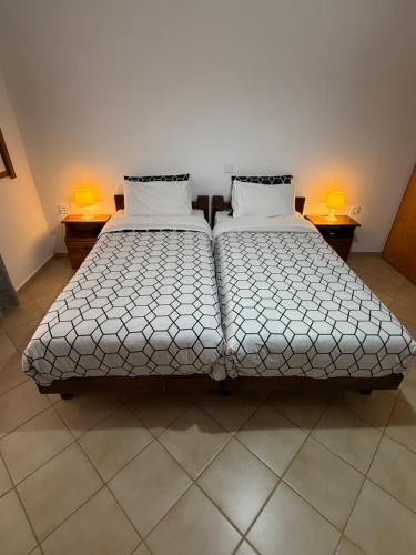two beds sitting next to each other in a room at Evita Luxury Apartments in Spilia