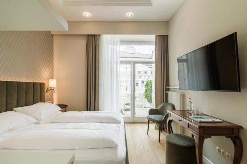 Postel nebo postele na pokoji v ubytování Hotel Europa Splendid