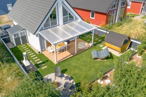 an overhead view of a house with a gazebo at Pet-Welcoming Stay with Sauna, Style & Privacy in Wandlitz