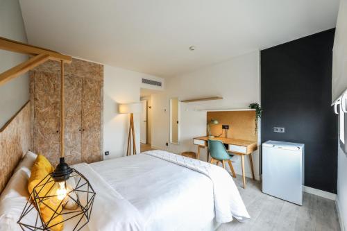 Ένα ή περισσότερα κρεβάτια σε δωμάτιο στο Habitaciones Atocha Rio