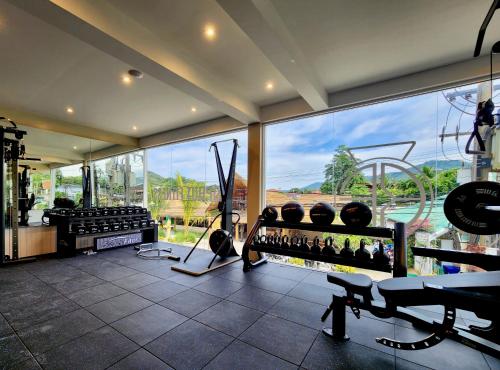 a room with a gym with a large window at Baan Bophut Beach Hotel Samui - SHA Extra Plus in Bophut 