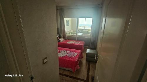 Una cama o camas en una habitación de Appartement de plage front de mer