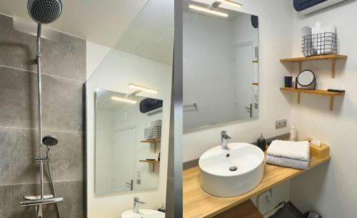 une salle de bain avec un lavabo et un miroir dans l'établissement Côté Remparts, Central, Face à la Vieille Ville & Parking Privé GRATUIT, à Boulogne-sur-Mer