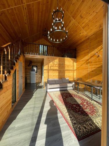 a large room with a couch and a rug on the floor at Jyrgallife in Darkan