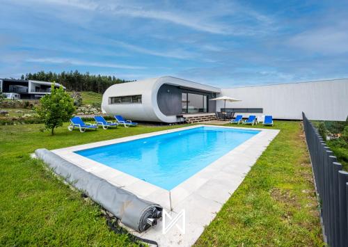 a pod house with a swimming pool in a yard at MyStay - Varanda de Basto in Canedo de Basto