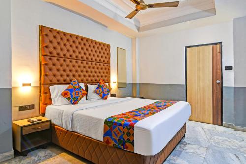 a bedroom with a large bed in a room at FabHotel Gulshan International - Nr Peter Cat Park Street in Kolkata