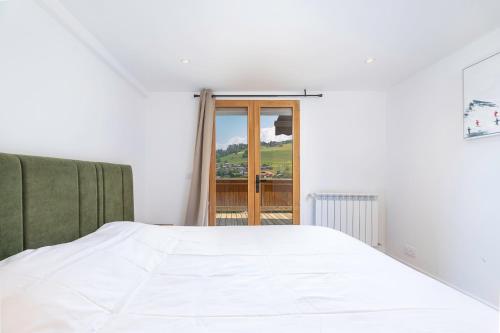 Ένα ή περισσότερα κρεβάτια σε δωμάτιο στο Apartments in Chalet Nessa